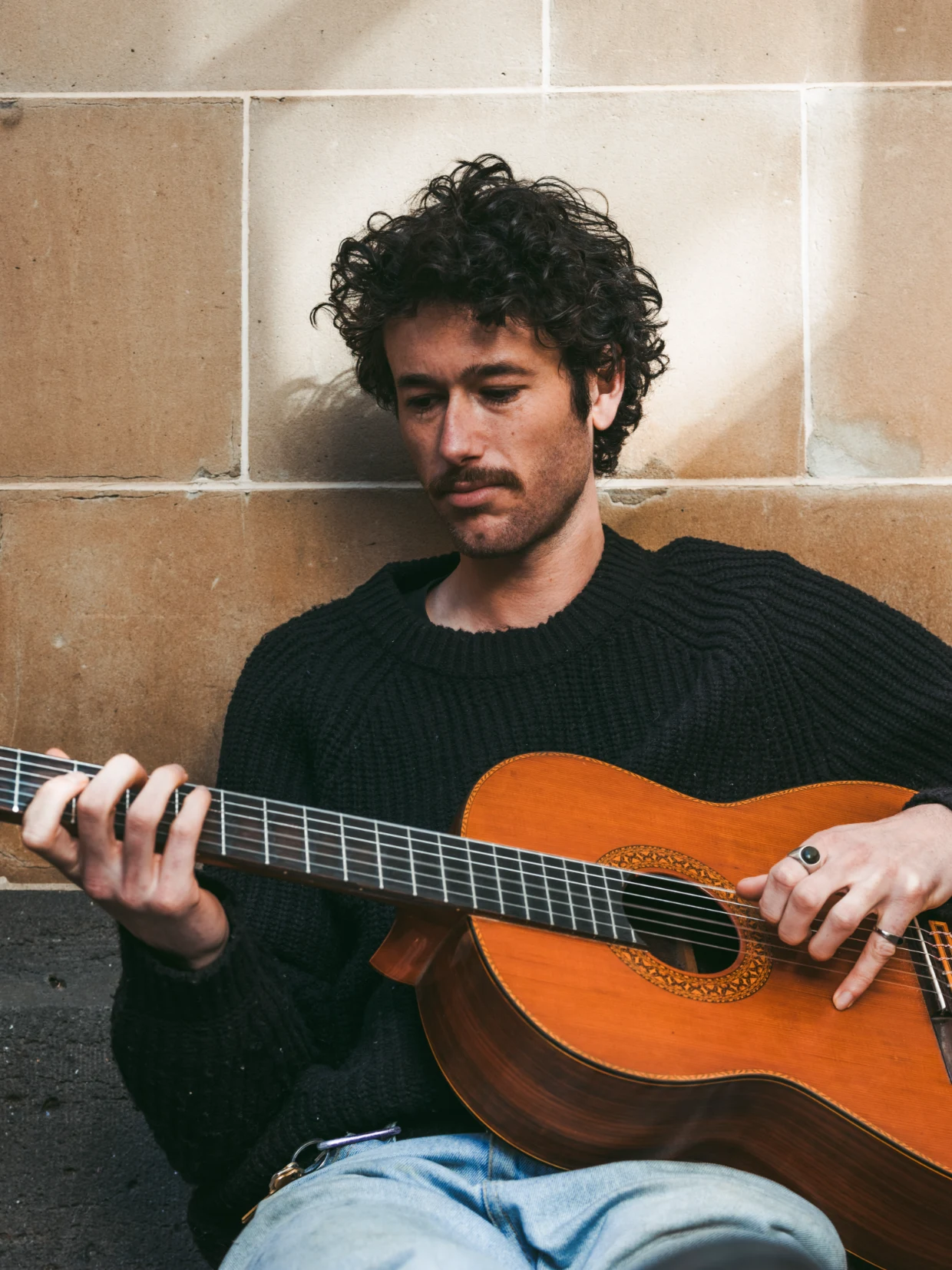 Tom Cribb, New Zealand indie folk and country songwriter, playing classical guitar